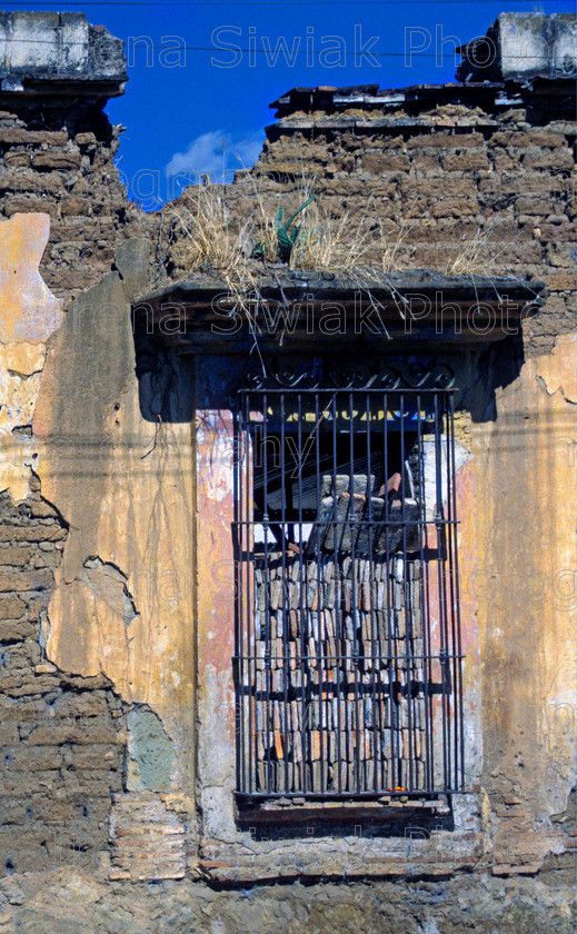 mexico 556 
 Detail of window in Mexico. 
 Keywords: mexico wall window railing derelict detail bricked bricks blue sky
